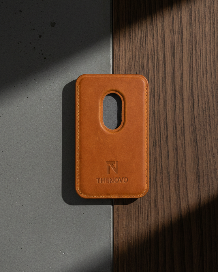 MagSafe Leather Wallet in tan Crazy Horse leather with a cutout for easy access on a textured surface