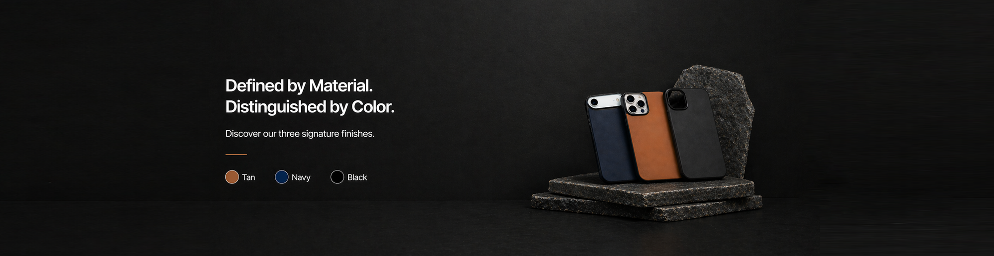 Three phone cases made from Crazy Horse leather in tan, navy, and black displayed on a dark surface.