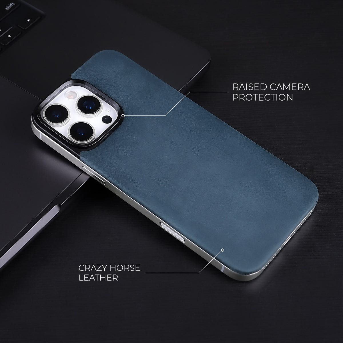 Navy Crazy Horse magnetic leather back for iPhone 16 Pro Max and 16 Pro, on a dark desk
