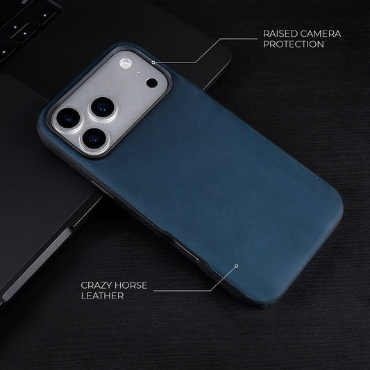 Navy Crazy Horse hybrid leather cover for iPhone 17 Pro Max, 17 Pro, 18 Pro Max and 18 Pro, on a dark desk