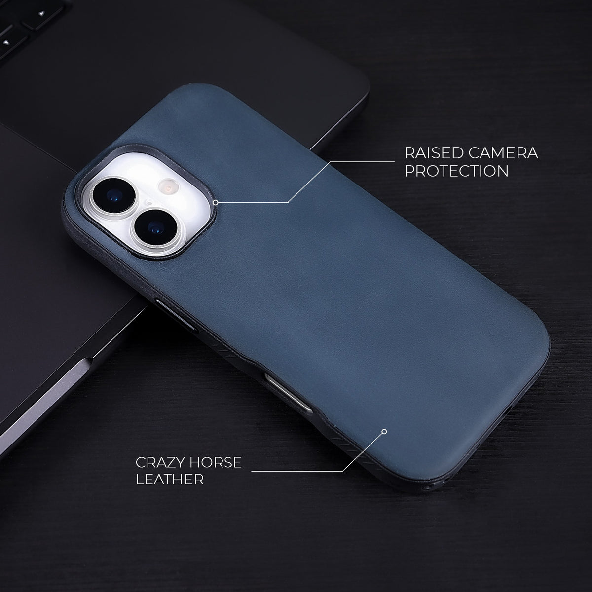 Navy Crazy Horse hybrid leather cover for iPhone 17 and 16, on a dark desk